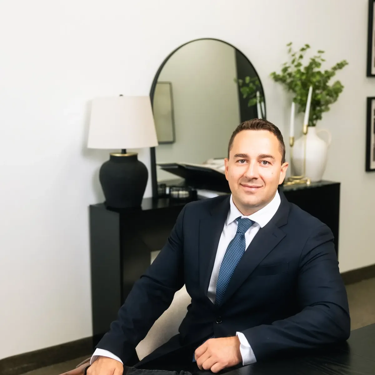 Anthony Krasno, Broker at Estate Mortgage Group, seated in his office